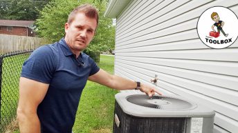 Photo of Tracey Miller, Realtor cleaning central AC unit