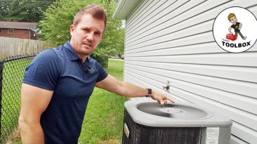 Photo of Tracey Miller, Realtor cleaning central AC unit