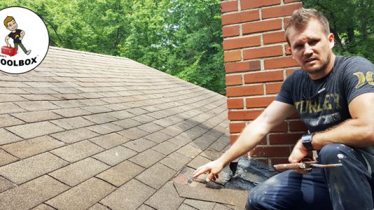 Photo of Tracey Miller, Realtor repairing roof shingles