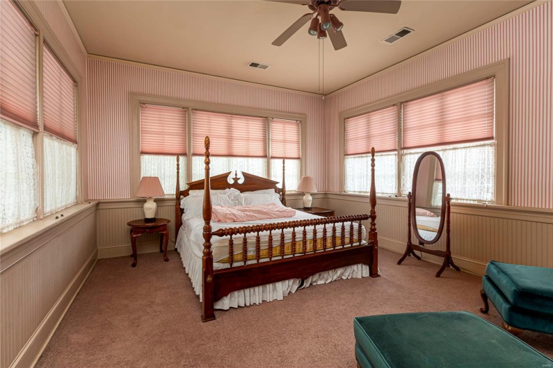 Bedroom featuring ceiling fan and light colored carpet