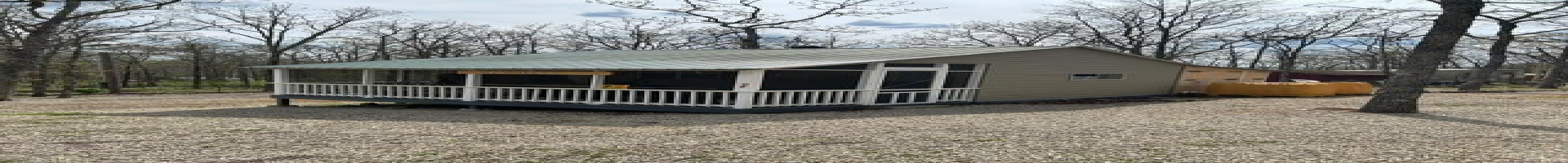 Residential For Sale Rear view of house with a sunroom and metal roof