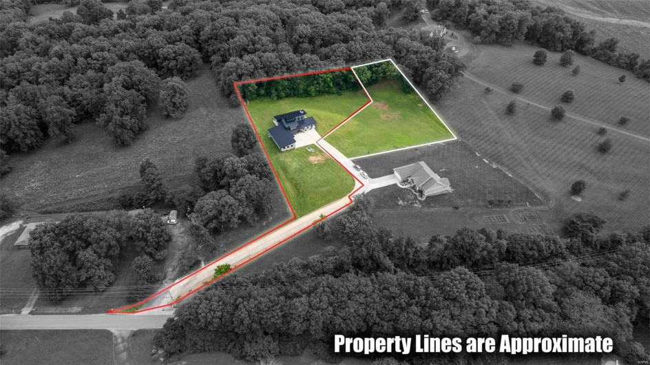 2.457 acres. Can keep or sell off 1 acre  highlighted in white