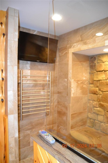 Heated Towel Rack and TV in Master Shower