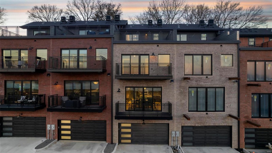 Outdoor building at dusk with a garage