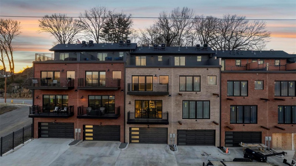 Outdoor building at dusk with a garage