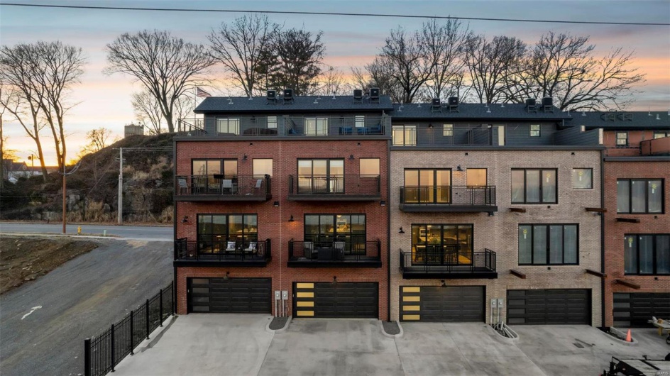 Outdoor building at dusk with a garage