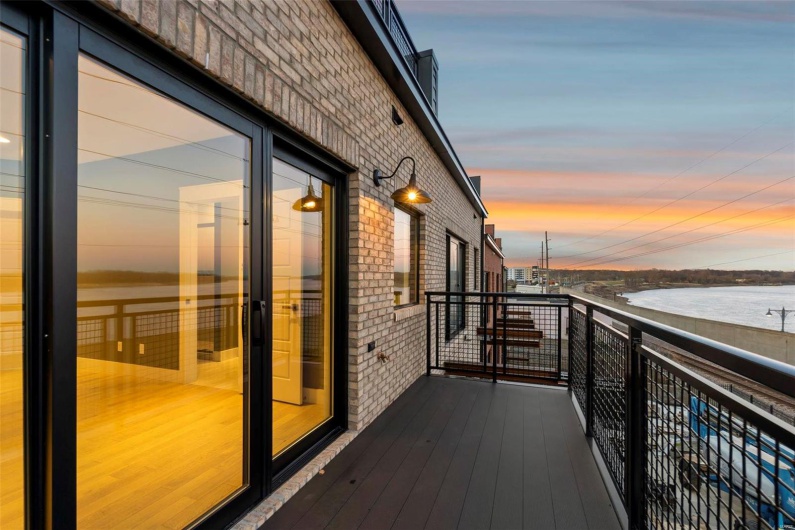 Balcony at dusk with a water view