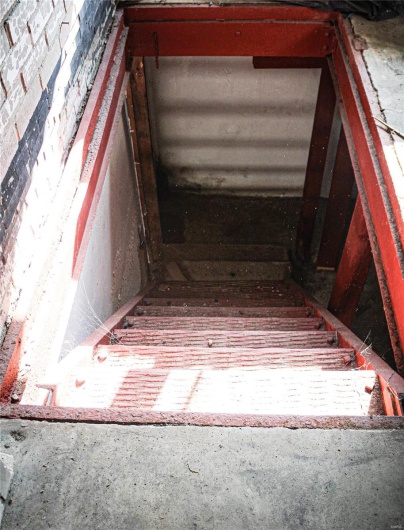 Steel stairs leading to lower level in 629 Bank St.