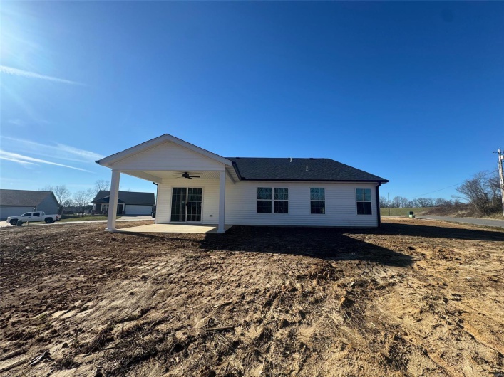 Rear view of property with a patio and ceiling fan
