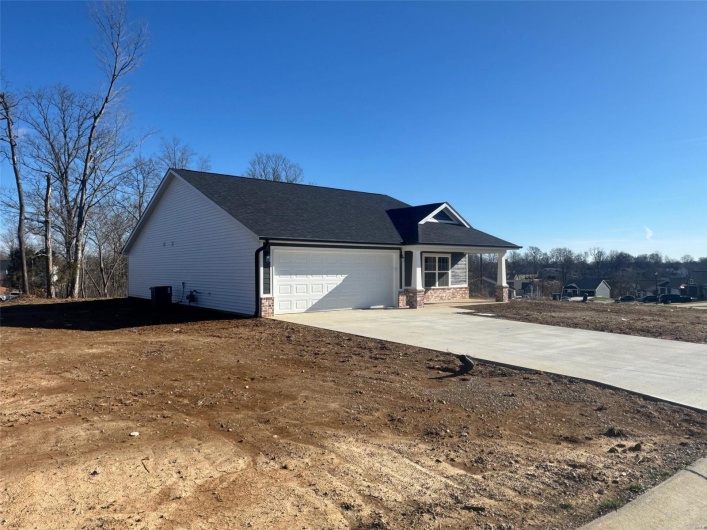 View of front of home featuring a garage