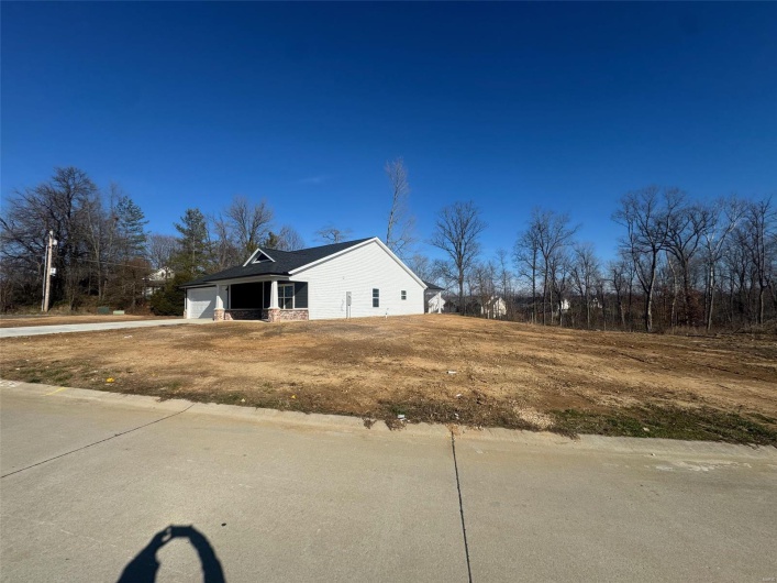 View of side of property featuring a garage