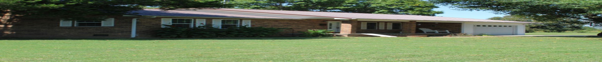 Residential For Sale Ranch-style home featuring a garage and a front lawn