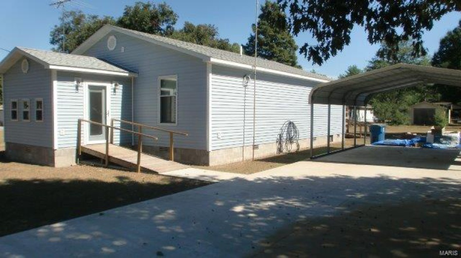 View of home's exterior featuring a carport