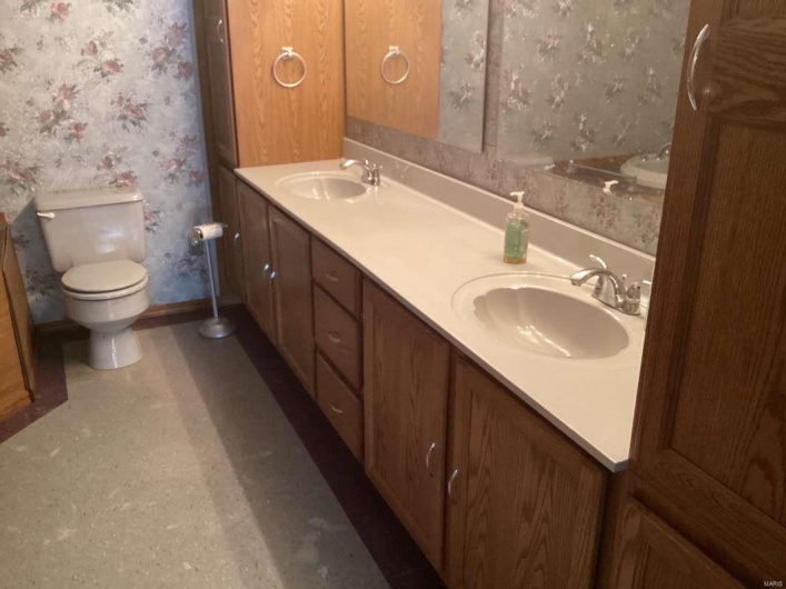 Bathroom featuring vanity and toilet