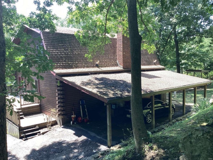 View of home's exterior featuring a carport