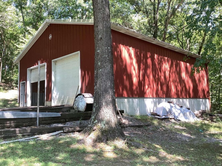 View of outbuilding featuring a garage