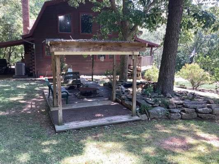 View of yard featuring cooling unit and a wooden deck