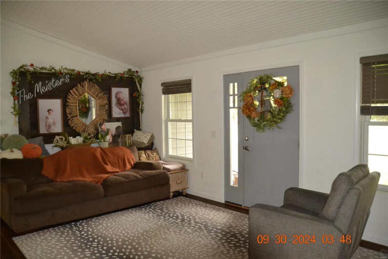 Living room with lofted ceiling