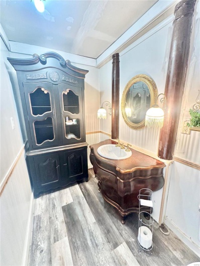 Bathroom with vanity and hardwood / wood-style flooring