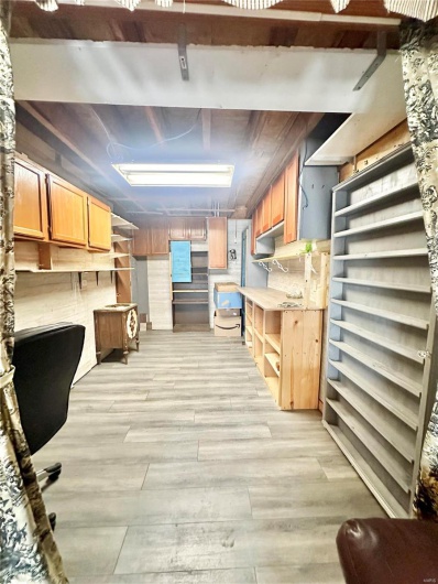 Basement featuring light hardwood / wood-style flooring