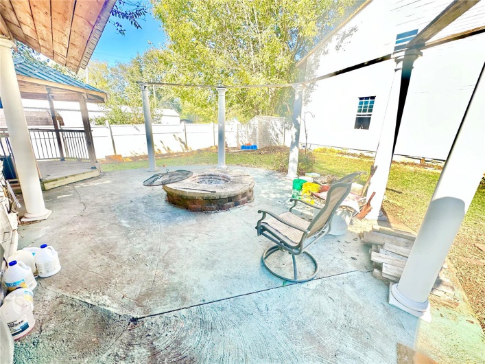 View of patio featuring a fire pit