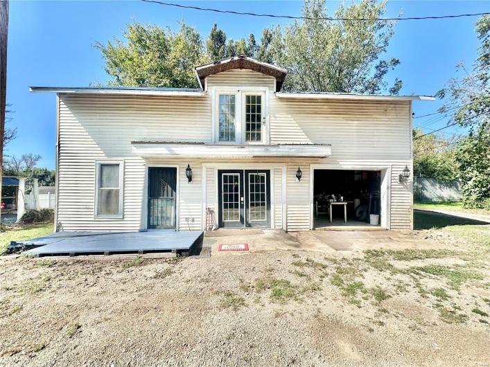 Rear view of property featuring a wooden deck