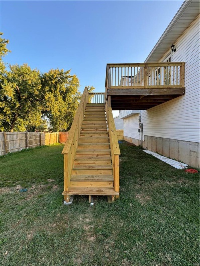 View of yard with a wooden deck