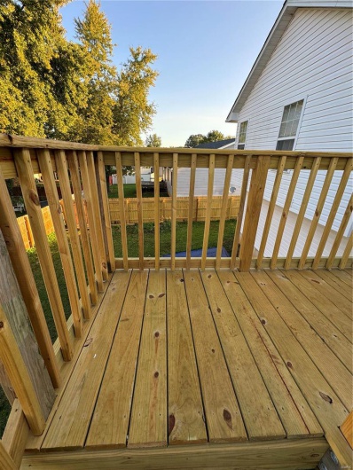 Deck featuring a lawn