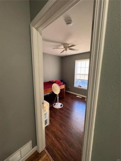 Bedroom2  featuring ceiling fan and dark wood-type flooring