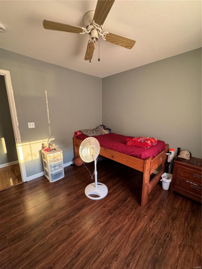 Bedroom 2 with ceiling fan and dark hardwood / wood-style floors