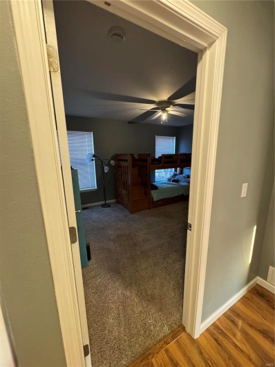 Corridor featuring hardwood / wood-style flooring