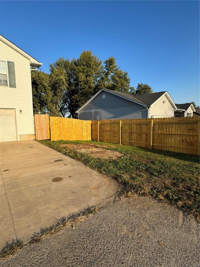 View of yard with a garage