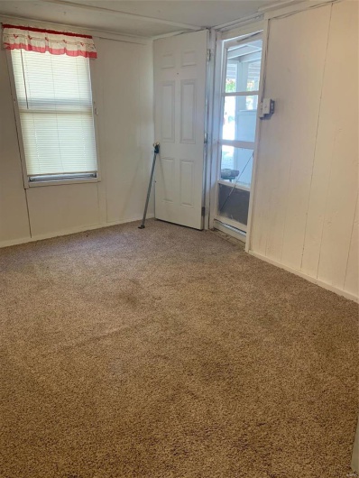 Empty room with carpet flooring