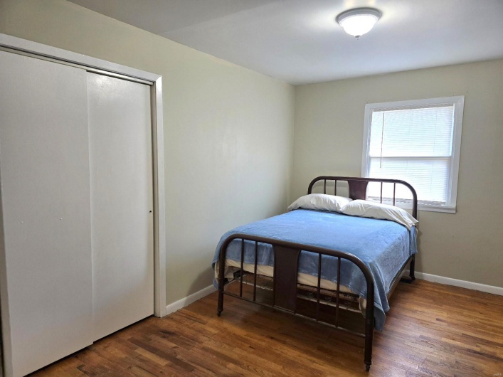 Bedroom featuring dark hardwood / wood-style flooring