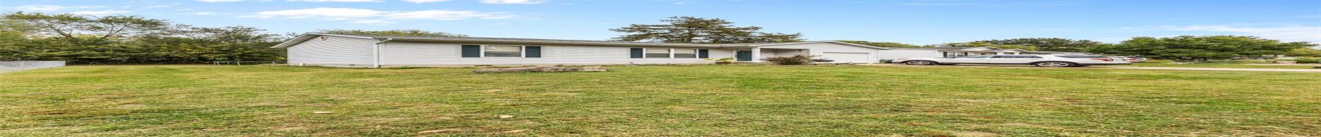 Residential For Sale View of front of home featuring a front lawn and a garage