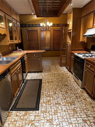 Kitchen with sink, range