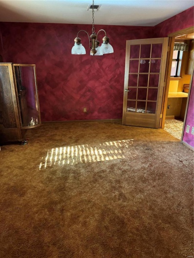 Unfurnished dining area with carpet floors