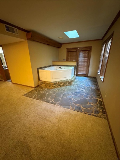 jacuzzi tub in primary bedroom