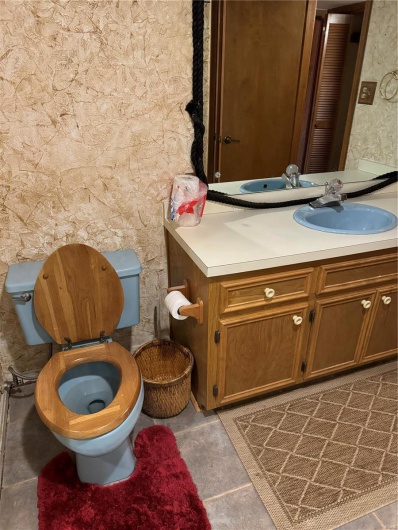 Bathroom with vanity and toilet