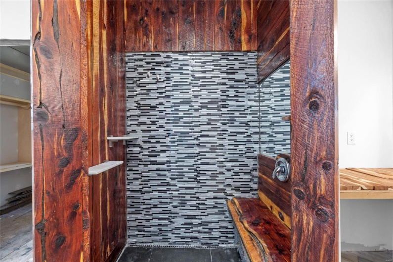 Bathroom featuring tile and rustic features