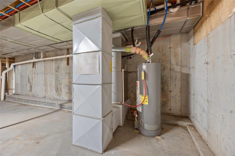 Utility area w/ water heater and hvac