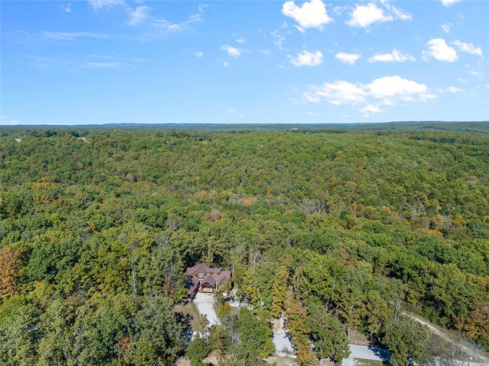 More aerial views of the home and nearby area