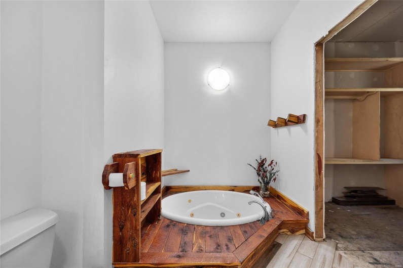 Bathroom featuring a tub 