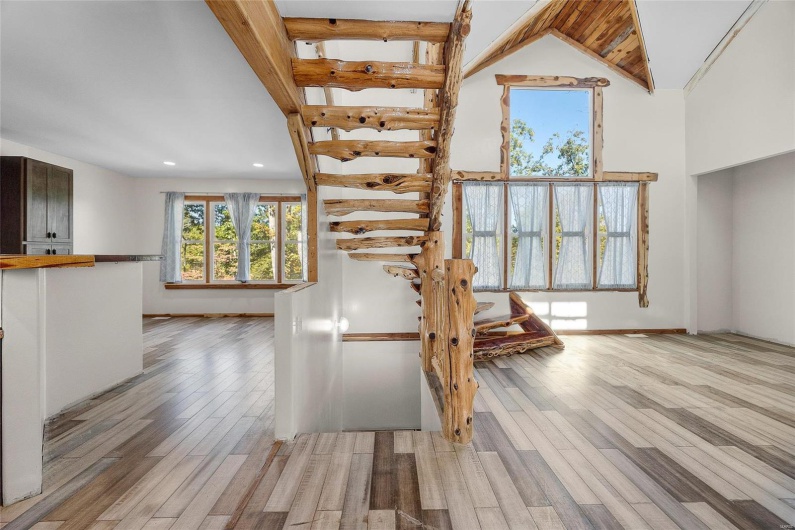Staircase divides kitchen and living room