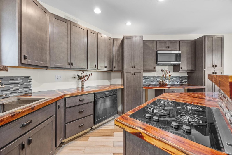 gas cooktop and resin wood countertops