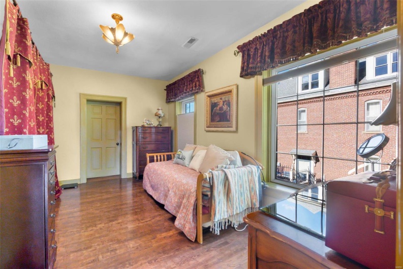 Bedroom featuring dark hardwood / wood-style floors
