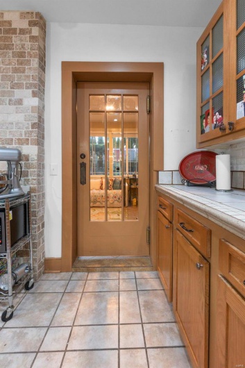 Kitchen with light tile patterned floors