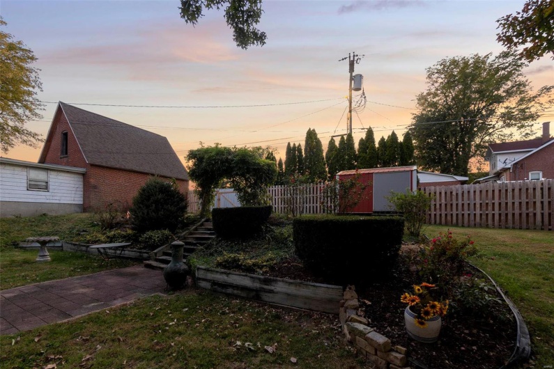 Yard at dusk with a storage unit
