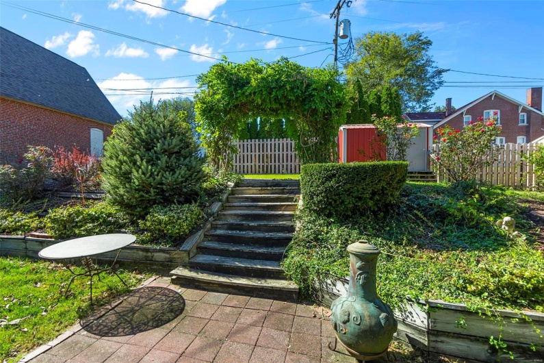 View of yard with a storage unit