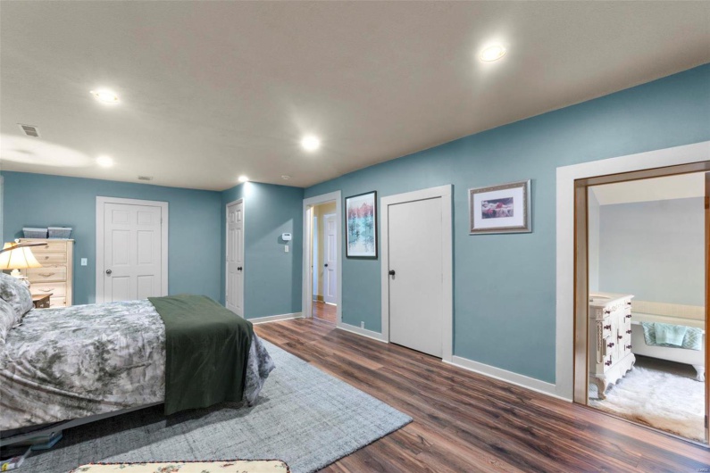 Bedroom with dark wood-type flooring